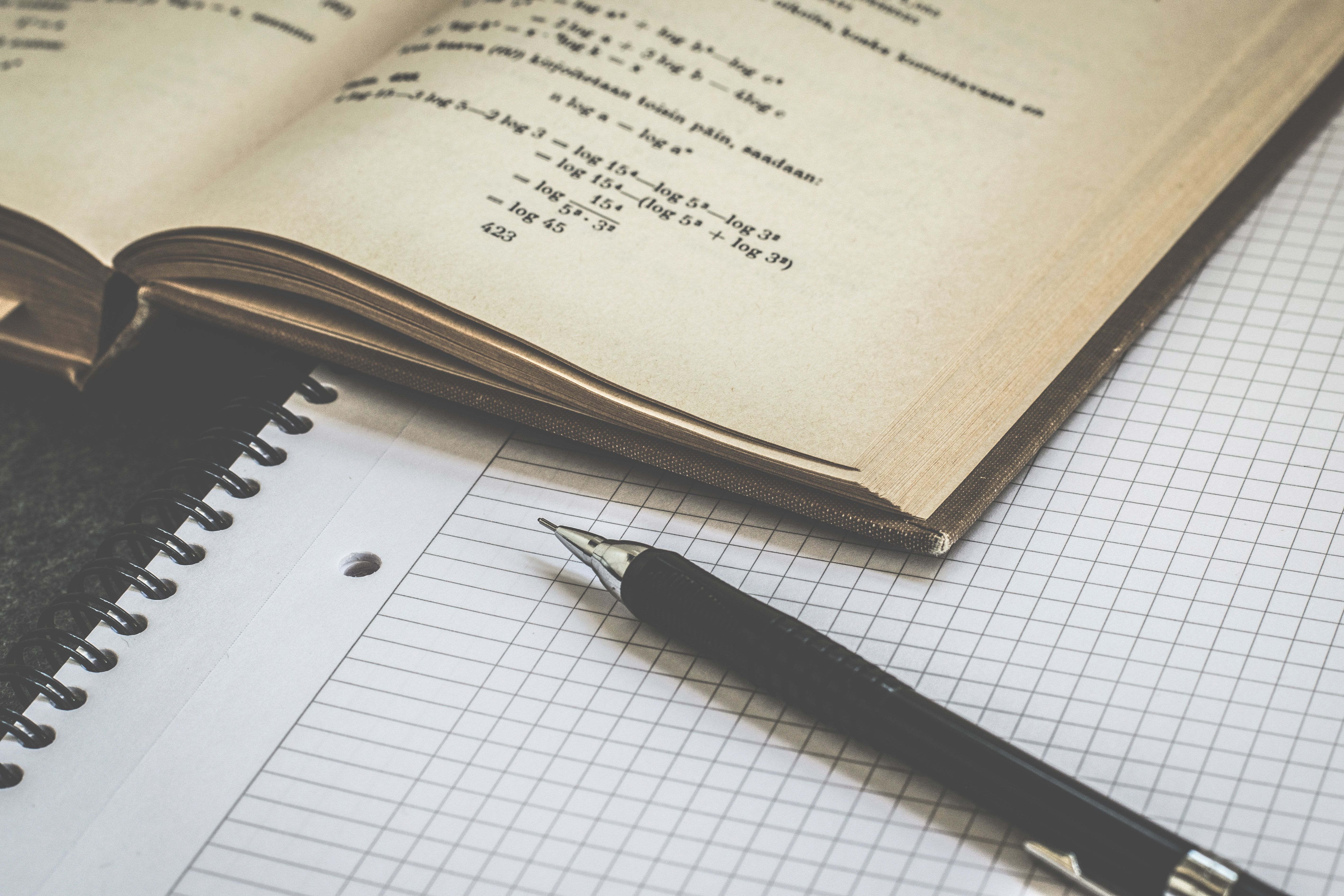 A math notebook and pen